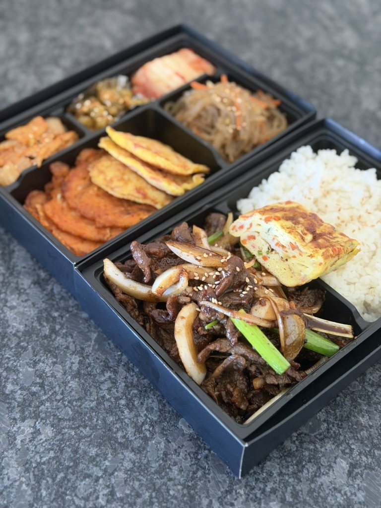 Bulgogi combo set: beef and onions, rice and egg roll with a second tier of jeon and banchan