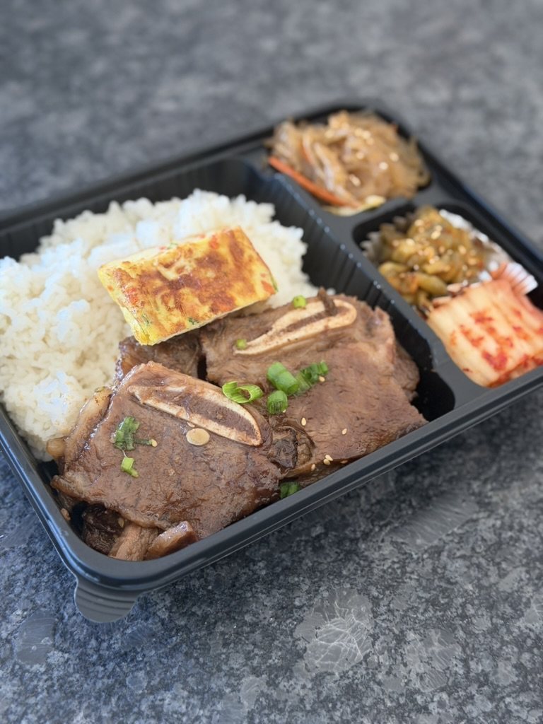 Galbi plain set: short ribs, rice, egg roll and three small banchan in one tray