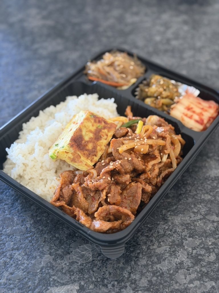Spicy pork plain set: pork, rice, egg roll and three small banchan in one tray